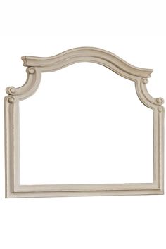 a white wooden frame with carvings on the sides and an arched design at the top