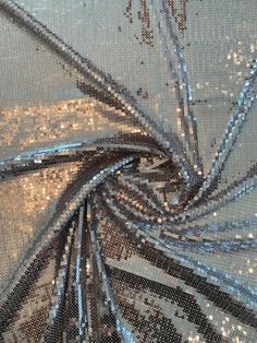 This silver all-over sequins on tulle designer fashion fabric offers a celebratory moment, a sense of finding the silver lining. SKU: 8588 Content: 100% Polyester Color: Silver Width: 54 inches This fabric is a last cut and no longer in production. Once sold out, we are unable to get more. Sequin Material, Sewing Workshop, Silver Fabric, Silver Lining, Fashion Fabric, Fabric By The Yard, Designer Fashion, Sequin, Sense