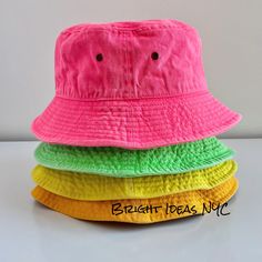 Fun and stylish Washed Bright Neon Bucket Hat that makes the perfect accessory. 100% breathable cotton Super comfy Brass Eyelets for ventilation Can be folded and packed for easy travel Circumference: 22-22.8 inches (56-58cm) To view the rest of our collection, please visit: brightideasnyc.com Fashion Bucket Hat, Bucket Hat Beach, Bucket Hat Fashion, Easy Travel, Beach Hat, Bucket Hats, Colorful Fashion, Sun Hats, Hat Fashion