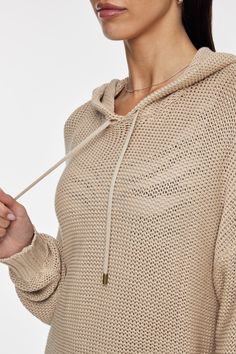 Textured knit hoodie Drawstring neckline Dropped shoulders Ribbed hem Relaxed fit Imported 100% organic cotton USW224087-Pebble Spring Sweater With Drawstring Hood, Spring Stretch Sweater With Drawstring Hood, Knit Hoodie With Drawstring Hood, Knit Hoodie Tops, Knit Hoodie Tops With Drawstring Hood, Beige Knit Hoodie For Fall, Stretch Knit Hoodie For Fall, Knit Hoodie With Drawstring, Knit Hoodie Sweater With Drawstring Hood