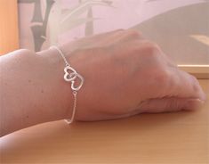 Very pretty, sterling silver linked heart, chain bracelet. The bracelet measures 7.5 inches in length (19cm) maximum. This bracelet can be adjusted to suit a smaller wrist and reduce down to 6.5 inches. A sturdy, sterling silver lobster clasp is attached. The bracelet is stamped 925.   This bracelet will be gift wrapped in acid free tissue paper and pretty organzo gift bag.  UK delivery can take between 1-2 working days.   U.SA & Europe delivery can take 10-28 working days for delivery. Cheap Silver Heart Chain Bracelet, Cheap Double Heart Jewelry For Everyday, Cheap Dainty Heart Bracelet For Gift, Cheap Metal Heart Bracelet With Heart Beads, Cheap White Heart Bracelet For Everyday Wear, Affordable Adjustable Heart Bracelet, Cheap Handmade Heart-shaped Bracelets, Elegant Affordable Heart Bracelet Gift, Cheap Adjustable Heart Bracelet For Parties