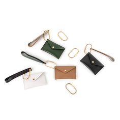 four different types of leather purses with metal handles