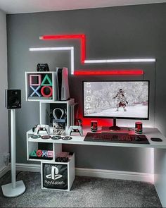 a gaming room with a computer and various accessories