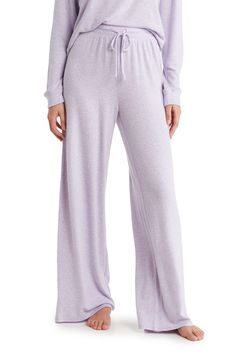 Keep comfy while you search for a new series to watch in these wide-leg pants cut from soft and stretchy fabric. Elastic/drawstring waist 73% rayon, 24% polyester, 3% spandex Machine wash, tumble dry Imported Comfortable Cotton Sleep Pants, Cotton Sleep Pants With Pockets, Casual Sleep Pants With Pockets, Casual Sleep Pants With Elastic Waistband, Casual Relaxed Fit Sleep Pants, Casual Solid Bottoms For Pajama Party, Comfy Relaxed Fit Pants For Relaxation, Relaxed Fit Pants With Pockets For Pajama Party, Casual Wide-leg Sleep Bottoms