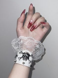 This bracelet features skeleton and stud decorations with lace trim design, available in pure white, pure black, and black and white.   The price is for a bracelet only, others are not included. Vkei Jewellery, White Punk Jewelry For Festival, White Punk Festival Jewelry, White Gothic Skull Jewelry, Gothic White Jewelry For Festivals, White Gothic Jewelry For Festivals, Gothic White Festival Jewelry, White Gothic Festival Jewelry, Vkei Nails