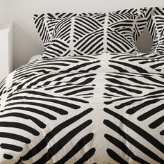 black and white bedding with zebra print on it