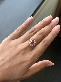 a woman's hand with a ring on it