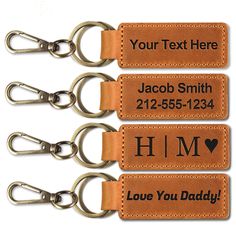 three leather keychains with personalized text on them