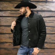 This Mens Suede Trucker Jacket mixes the old west with contemporary fashion. Made out of faux suede, this jacket has a snap front storm flap. Two side-entry pockets give it an authentic Western look. Throw this jacket on over anything and for warmth and an authentic western look. Zipper and snap closure Adjustable snap sleeves Soft faux shearling lining and collar Western Jackets, Suede Trucker Jacket, The Old West, Western Look, Aviator Jackets, Trucker Jacket, Old West, Contemporary Fashion, Snap Closure