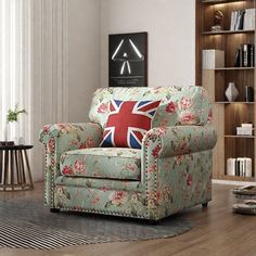 a living room filled with furniture and a flag pillow on the back of the chair