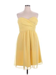 a yellow dress on a mannequin dummy