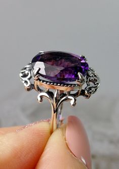 Oval Amethyst Ring With Filigree Detail, Oval Amethyst Ring With Intricate Design, Oval Purple Ring With Intricate Design, Purple Oval Ring With Intricate Design, Ornate Oval Amethyst Ring, Purple Oval Filigree Rings, Purple Oval Amethyst Ring With Filigree, Oval Purple Amethyst Ring With Filigree, Ornate Oval Amethyst Gemstone Ring