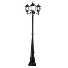 a black lamp post with two lights on each end and one light on the other side