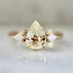 an engagement ring with two pear shaped diamonds