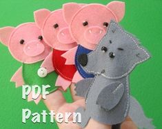 a hand is holding five little pigs in different colors and sizes, with the words pof pattern below them