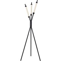 three black and white candles on a tripod with two lights in the middle,