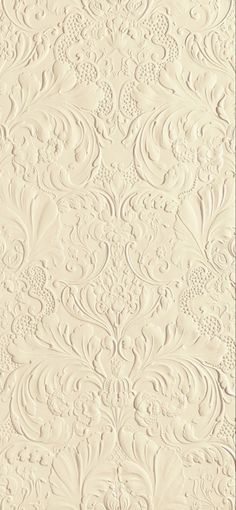 an ornate wallpaper pattern with white paint