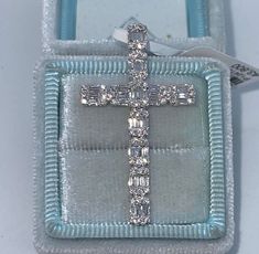 Beautiful Diamond Cross Pendant.  Unique design baguette and round diamond cross.  Excellent craftsmanship, all very sparkling diamonds.  The chain slides through the back for a clean look.  Lays nicely on the neck, won't flip around.   The diamonds really catches the light beautifully.  This beautiful cross is one you will cherish for life.  Cross is a nice size measures about 40 x 23mm.  Clean Diamonds even when you look under a magnifying glass.  White gold sold out.   Genuine Diamonds Round Brilliant and Baguette Cut Diamonds  Total Weight: 1.10 Carats  Clarity: VS/SI Color: F  Clean clean Diamonds, absolutely no black carbon spots.   Solid 18K White Gold 3.56 grams Comes with gift box.   *please let us know if you need a gold chain for purchase  * We have been in the wholesale Jewelry Flower Diamond Ring, Diamond Cross Necklace, Diamond Cross Necklaces, Beautiful Cross, Diamond Cross Pendants, Diamond Cross, Sell Gold, Diamond Star, Cross Jewelry