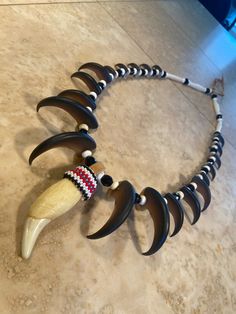 a necklace made out of horns and beads