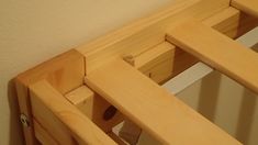 the bottom section of a wooden bed frame