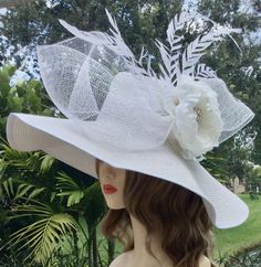 Step into the world of elegance ad tradition with this exquisite Ketucky Derby wide brim hat.  Handcafted with the finest materials, the hat boasts a wide brim that gracefully frames your face creating aura of sophication and charm.  Perfect for church, tea party or ay special occasion.  Available in several colors upon request. White Flat Brim Panama Hat For Kentucky Derby, White Panama Hat For Spring Formal Events, White Panama Hat For Kentucky Derby Formal, White Panama Hat For Kentucky Derby, White Elegant Panama Hat, Elegant White Adjustable Panama Hat, Formal White Straw Hat With Curved Brim, Elegant High Crown Straw Hat For Beach, Chic White Panama Hat For Kentucky Derby