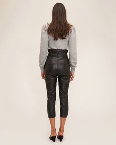 An update to our high-waist leather pant, the Anniston features a removable D-ring grommet belt and slightly tailored fit. High-waist fit Asymmetrical waist detail Slim fit Functional front slant pockets Front fly zipper closure Back welt pockets Removable D-ring belt with grommet detail 100% Polyester Lining 100% Lamb Leather Model is 5’10” and wearing a size 2. This style runs true to size with an intentionally cropped, tailored fit. We would recommend taking your regular size. High-waisted Leather Pants With Zipper For Work, Chic High-waisted Leather Pants With Zipper, Sleek Leather Pants With Zipper For Work, Chic High-waisted Leather Pants With Belt Loops, Sleek High Waist Leather Pants With Belt Loops, Chic High Rise Bottoms With Zip Fly, Fall Leather Pants With Belt Loops For Office, Chic Leather Pants With Zip Fly For Fall, Sleek Leather Pants With Belt Loops For Work