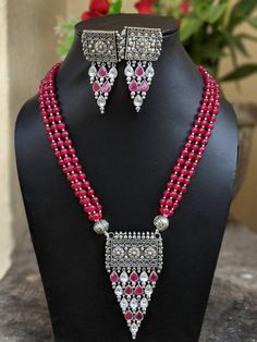 Adorn your beautiful personality with this exquisitely designed and handcrafted beaded necklace and matching earrings combo set in high quality German Silver. Pair it up with any formal or semi formal attire and gather compliments at the next event!Necklace length 13.5 inches Necklace weight 102 GM'sEarrings weight 34 GM'sLength 2.7"Width 1.2"******************************************Note: All in stock items will be shipped from New Delhi, India within 2-3 business days after receipt of payment. Festive Beaded Silver Jewelry Sets, Festive Silver Beaded Jewelry Sets, Festive Celebration Jewelry Sets With Polished Beads, Silver Beaded Kundan Necklace For Diwali, Traditional Festive Jewelry Sets With Silver Beads, Festive Silver Temple Jewelry Beads, Silver Beads For Festive Occasions, Festive Silver Beaded Necklaces With Stone Work, Festive Silver Beads For Celebrations