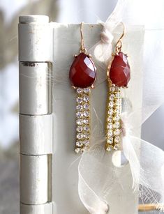 "These lovely earrings combine a pair of vintage clip on earrings (with the clip removed), that appear to be carnelian or a similar colored stone, with some rhinestone elements to create an elegant pair of earrings, suitable for an evening out or a special event. I enjoy collecting vintage and antique remnants and jewelry parts that could use some repurposing and/or upscaling. The length of these, minus the earwire, is 1 7/8\". I work with antique and vintage parts. Some may show signs of wear o Elegant Carnelian Dangle Earrings, Gold Carnelian Jewelry With Matching Earrings, Elegant Carnelian Drop Earrings, Red Dangle Jewelry With Gemstone Accents, Elegant Gold Carnelian Earrings, Red Gemstone Accented Drop Earrings, Gold Carnelian Jewelry For Wedding, Marble Necklace, Lucite Jewelry