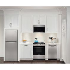 a kitchen with white cabinets and stainless steel appliances