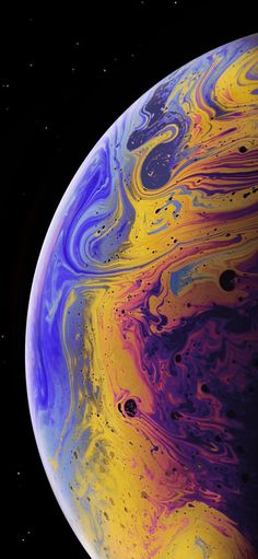 an image of the planet with colorful paint on it's surface and black background