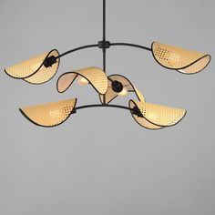 a chandelier with five lights hanging from it's sides and four petals on each side