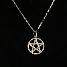 Our stylish Pentagram Charm is sterling silver plated in rhodium with cubic zirconia stones hung on a 16" sterling silver chain. A Pentagram is a symbol of protection with the five points on the star representing earth, air, water, fire and spirit. Don't let the Hollywood movies who've gotten it wrong throw you.... a pentagram is not a negative or evil symbol. It's roots actually date back to Ancient Greece and Babylonia and was a symbol used by Christians for a time to represent the five wounds Diy Pentagram Necklace, Protection Pentagram, Pentacle Necklace Aesthetic, Pentagram Necklace Aesthetic, Silver Pentagram Necklace, Symbol Of Protection, Hollywood Movies, Five Points, Ancient Greece