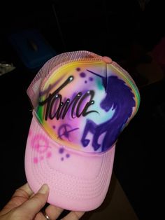 Fun Unicorn design on a trucker cap, can add a name or nickname to personalize (no extra cost).  Can also use a different background or colors, please use notes section to describe your design.  Custom graphics or logos on airbrushed on trucker style hats - these are ideal gifts and can be purchased in bulk for party favors at a special price.  These upgraded airbrush hats feature the incredible artwork of our talented artist Fester,  the attention to detail is unmatched! No two hats are the sam Customizable Multicolor Trucker Hat, Fun Multicolor Customizable Hats, Customizable Fun Pink Baseball Cap, Customizable Pink Fun Baseball Cap, Customizable Multicolor Snapback Baseball Cap, Customizable Multicolor Baseball Cap, Novelty Multicolor Trucker Hat Snapback, Novelty Multicolor Snapback Trucker Hat, Customizable Multicolor Snapback Trucker Hat