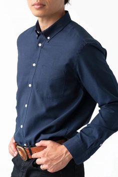 Man wearing a navy blue shirt Navy Cotton Dress Shirt For Business, Casual Navy Button-up Dress Shirt, Cotton Dress Shirt With Relaxed Fit For Fall, Navy Long Sleeve Cotton Dress Shirt, Cotton Button-up Dress Shirt For Fall, Cotton Relaxed Fit Dress Shirt For Fall, Relaxed Fit Cotton Dress Shirt For Fall, Fall Cotton Dress Shirt In Relaxed Fit, Fall Cotton Dress Shirt Relaxed Fit