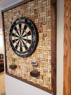 a dart board mounted to the side of a wall