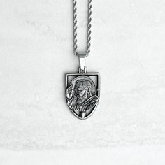 To achieve the details and quality of In Via metals each piece is individually cast by our jeweler in California.  This piece holds true to the Catholic who defends their faith and family with prayer. It is designed to be strong and sturdy to allow you to carry a portrait of St. Padre Pio, wherever you may be. Each prayer piece purchased from Shopinvia will provide a rosary to a person who is homeless. Message me for more information! Metal: Distressed  Chain: 22'' stainless steel rope chain Designed by: Christian J.L. Silver Polished Medallion Necklace, Symbolic Silver Medallion Necklace Tarnish Resistant, Symbolic Silver Medallion Necklace, Symbolic Silver Tarnish Resistant Medallion Necklace, Symbolic Silver Tarnish-resistant Medallion Necklace, Silver Spiritual Medallion Necklace Tarnish Resistant, Spiritual Silver Medallion Necklace Tarnish Resistant, Silver Spiritual Medallion Necklace, Spiritual Silver Medallion Necklace