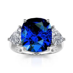 This stunningly beautiful three stone engagement ring would make anyone thrilled to receive it! The deep blue sapphire accented with two gorgeous white stones set in polished sterling silver provides a look that is very modern and classic at the same time! This ring is very fashionable and can add a touch of style to any outfit, yet it is also classy enough to pair easily with formal wear. This ring would be the perfect gift for yourself or your loved one!Carat Weight: 5.6 ctStone Size: 10*12 mm Delicate Wedding Ring, Rings Matching, Artistic Earrings, Rings Antique, Sterling Silver Engagement Rings, Antique Engagement, Three Stone Engagement, Three Stone Engagement Rings, Pretty Rings