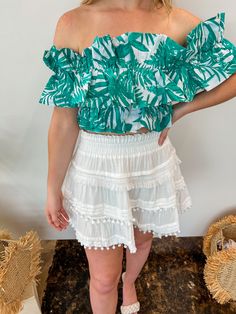 - green and white tropical print - tube top with off-shoulder sleeves - stretchy and TTS model is wearing small Casual Green Tube Top For The Beach, Green Summer Tube Top For Vacation, Green Strapless Top For Day Out, Green Strapless Tops For Vacation, Green Strapless Tube Top For Vacation, Casual Green Strapless Top, Casual Off-shoulder Crop Top For Vacation, Green Off-shoulder Crop Top For Summer, Green Off-shoulder Crop Top For Spring