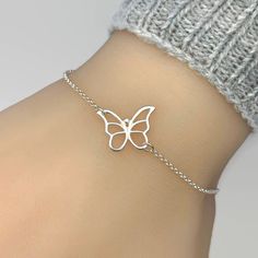 "Pictures are enlarged to show details of the item. Please refer to original size and measurements in the following description  Simple and adorable butterfly bracelet.  All components are sterling silver.  Butterfly measures 16x14mm. Adjustable length from 6.5\" to 7.5\". Simple and it looks good with anything!  ENTER OUR SHOP HERE for more jewellery : https://etsy.me/2yqbxk6 STORE POLICY: To make sure you're always 100% satisfied please read our store policies here prior to ordering: https://etsy.me/2RoEchD FOLLOW US on Facebook, Pinterest and Instagram: https://www.facebook.com/JewelleryByZM https://www.pinterest.co.uk/jewellerybyzm/ https://www.instagram.com/jewellerybyzm/" Silver Bracelet With Butterfly Clasp, Adjustable Dainty Butterfly Bracelet, White Butterfly Charm Bracelet For Gift, Silver Bracelet With Butterfly Clasp For Gift, Elegant Silver Bracelet With Butterfly Clasp, Delicate Silver Chain Bracelet As Gift, Butterfly Clasp Bracelets For Gift, Elegant Silver Butterfly Bracelets, White Butterfly Bracelet For Gift