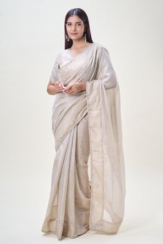 Beige saree with stone, zardozi embroidered border. Paired with V neck embroidered blouse. - Aza Fashions Raw Silk Saree With Unstitched Blouse For Reception, Bollywood Style Pre-draped Saree In Raw Silk, Elegant Chanderi Choli With Dori Work, Elegant Dola Silk Pre-draped Saree, Elegant Chanderi Pre-draped Saree With Zari Work, Bollywood Style Pre-draped Raw Silk Saree, Elegant Tissue Silk Choli With Dori Work, Elegant Chanderi Pre-draped Saree For Navratri, Bollywood Style Pre-draped Raw Silk Saree With Sheer Dupatta