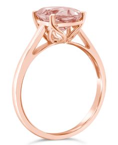 A 10mm x 8mm morganite forms the intriguing center of this stylish ring. Macy's Wedding Rings Diamond Cut, Formal Pink Gold Rings With Round Cut, Luxury Wedding Rings From Macy's, Macy's Oval Wedding Rings, Macy's Ring With Center Stone, Macy's Rings With Center Stone, Elegant 14k Gold Rings From Macy's, Macy's 14k Gold Wedding Rings, Formal Rose Gold Topaz Ring With Prong Setting