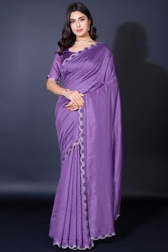 Elevate your elegance with this Designer Khadi Shimmer Saree, a perfect blend of traditional charm and modern allure. Crafted from luxurious Khadi Shimmer fabric, this saree features exquisite border work that gracefully frames the drape, adding a touch of sophistication to every pleat. The matching blouse, also in Khadi Shimmer, complements the saree for a seamless, radiant look. Slight color variations may occur due to digital imaging. Accessories shown are for styling purposes only and not in Shimmer Saree, Festive Saree, Sequins Saree, Fancy Fabric, Party Wear Lehenga Choli, Purple Saree, Readymade Saree, Gorgeous Blouses