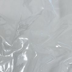 a close up view of the back of a white plastic bag that is partially covered in silver foil