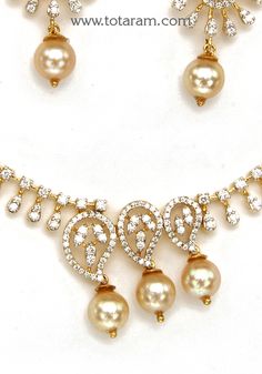 18 Karat Gold Diamond Necklace & Earrings Set with Pearls
    - 235-DS718 - in 25.700 Grams for USD $4134.84. 
Made in India by Totaram Jewelers Online this product is in Gold - 18 Karat Gold  & is an excellent gift for Adult - Women. Ships fully insured with secured guaranteed delivery for free with your order over $250 from New Jersey USA & comes with 30 days exchange policy. Elegant 22k Gold Necklace With Pearl Drop, Gold Pear-shaped Single Cut Diamond Jewelry, Pear-shaped Single Cut Diamond Gold Jewelry, Gold Diamond Pearl Drop Necklace, Gold Pear Shaped Diamond Necklace For Formal Occasions, Gold Pearl Drop Necklace With Diamond, Gold Pear-shaped Diamond Necklace For Formal Occasions, Formal Gold Pear Shaped Diamond Necklace, Elegant Gold Jewelry Sets With Single Cut Diamonds