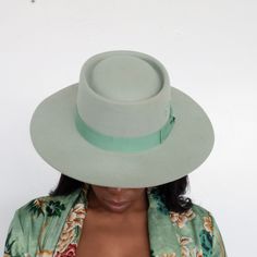 Turn heads & grab everyone’s attention in the Kayo Boater Hat in mint green. Highlighted in a calming mint green hue, it’s designed with an elongated brim, round top, and bow band for a dainty touch. Hand embroidered with BTR initials. 100% Australian Wool Adjustable inner band for sizing 4” Crown Height 3.25” Brim Multiple colors SHIPPING POLICY We process your order in 24-48 hours. Hats typically ship within 3-5 business days, or sooner. Expedited shipping options are available at checkout. We Green Hat Bands For Kentucky Derby, Adjustable Green Flat Brim Fedora, Green Short Brim Felt Hat For Summer, Summer Green Felt Hat With Short Brim, Adjustable Green Felt Hat For Summer, Green Adjustable Wide Brim Fedora, Green Fedora For Kentucky Derby, Adjustable Green Wide Brim Fedora, Adjustable Green Wide-brim Fedora