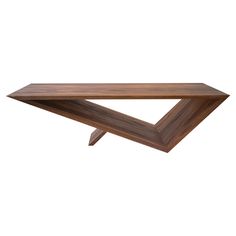 a wooden shelf sitting on top of a white wall in front of a white background