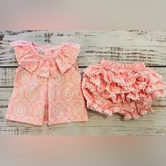 Introducing An Adorable Baby Girl's Pink Dress And Ruffled Bloomers Set, Perfect For Any Special Occasion Or Everyday Wear. Crafted With Utmost Care, This Outfit Features A Charming Pink Dress Adorned With Delicate Ruffles, Adding A Touch Of Elegance To Your Little One's Wardrobe. The Accompanying Ruffled Shorts Provide Comfort And Style, Allowing Your Baby Girl To Move Freely While Looking Absolutely Precious. Made From High-Quality Materials, This Ensemble Ensures Durability And Softness Again Skin Dress, Ruffled Shorts, Shrimp And Grits, Outfit Pink, Pink Ruffle, Ruffle Shorts, Boutique Brands, Adorable Baby