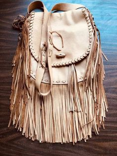 Fringe has always made a big fashion statement and the 70's vibe is back. If you like a fashion throwback look, this beautiful fringe bag is perfect for you. One touch of this soft, supple bag and you will want to add it to your handbag collection. This bag features plenty of storage with one front pocket, two interior pockets, and an adjustable shoulder strap. Cheap Casual Fringe Shoulder Bag, Daily Use Fringe Bags, Luxury Shopping Bag With Fringe, Cheap Daily Fringe Bags, Cheap Fringed Tote Shoulder Bag, Cheap Daily Use Fringe Bags, Cheap Bohemian Fringe Bags, Chic Affordable Fringe Bags, Luxury Chic Bags With Fringe