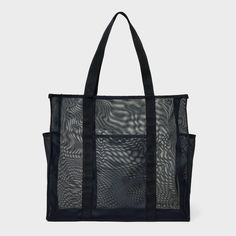 Whether it's time for a casual outing with friends or a trip to the farmers' market, you can carry all your essentials in the Mesh Tote Handbag from Shade & Shore™. This unstructured tote handbag has a mesh design to help you see through to the contents inside. It features an open main compartment along with front and side pockets to help keep water bottles and small items separate, and with the double handles, it's easy to carry over your shoulders or in hand. Shade & Shore™: Found exclusively Mesh Tote Bag, Shopping Totes, Black Beach, Monogram Tote Bags, Reversible Tote, Swimming Bag, Monogram Tote, Bags Aesthetic, Ellen Degeneres