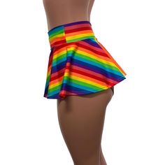 Made of stretchy rainbow stripe print spandex, this circle skater skirt swings and twirls with movement. Perfect for your pride parade outfit! The skirt length is 10" from top to bottom. Striped Fitted Short Length Skort, Multicolor Rave Skirt For Summer, Multicolor Stretch Rave Shorts, Striped Fitted Flared Skirt, Multicolor Stretch Skirted Skort, Playful Multicolor Skirted Bottoms, Fitted Multicolor Skirted Bottoms, Multicolor Summer Bottoms For Cheerleading, Fitted Rainbow Print Bottoms For Summer